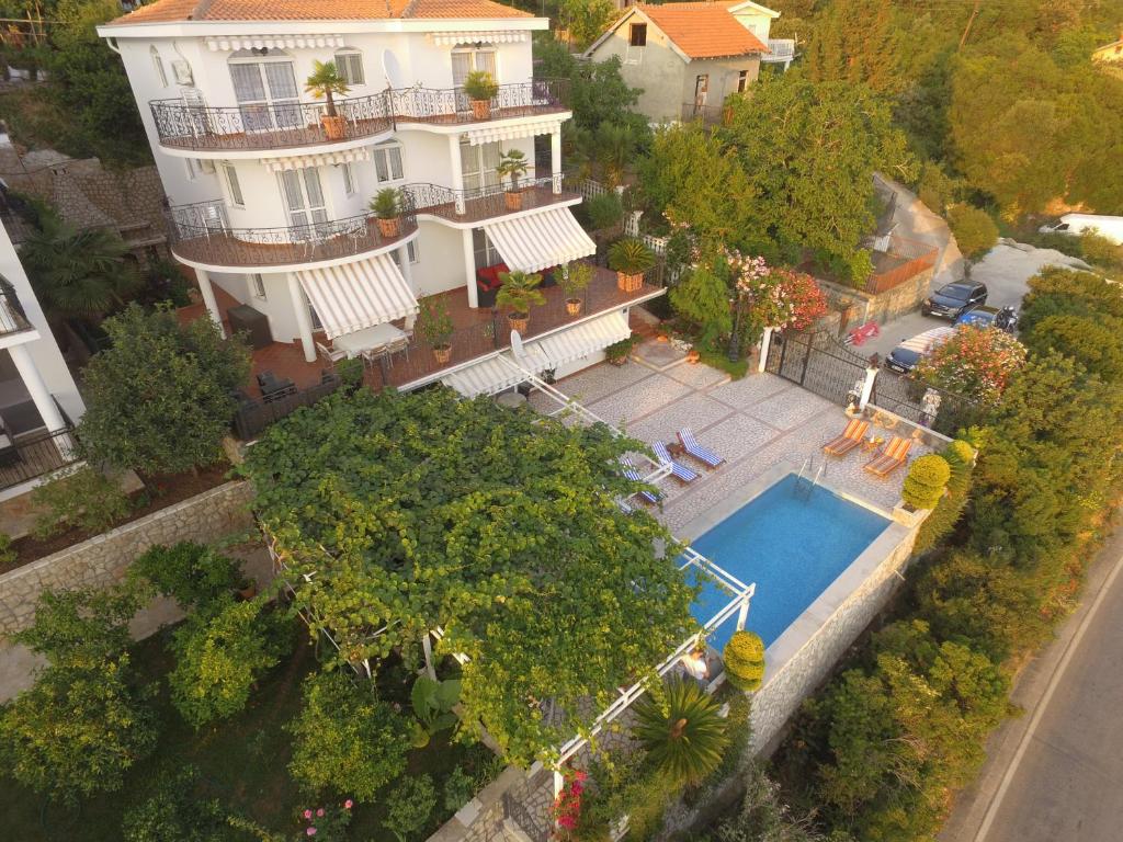 an aerial view of a house and a swimming pool at Apartments Bardak in Dobra Voda