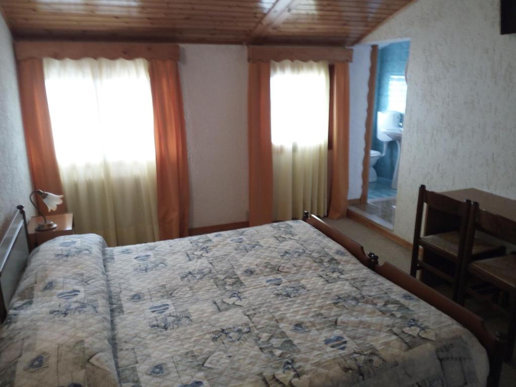 Postel nebo postele na pokoji v ubytování Albergo Al Pino