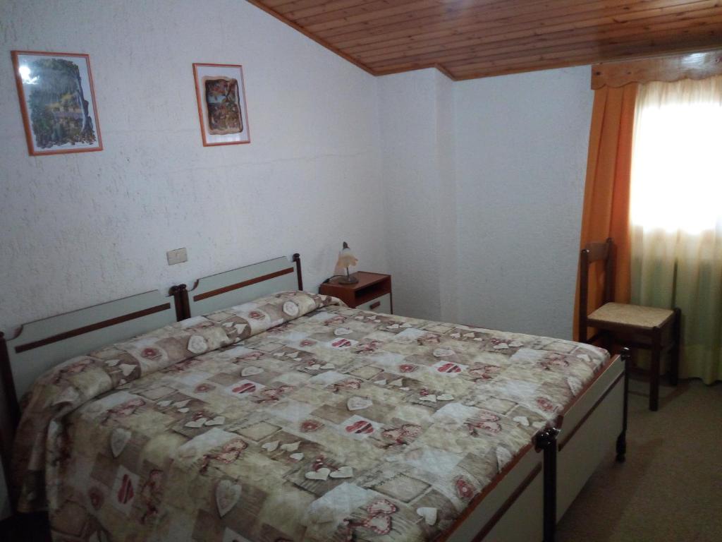 Postel nebo postele na pokoji v ubytování Albergo Al Pino