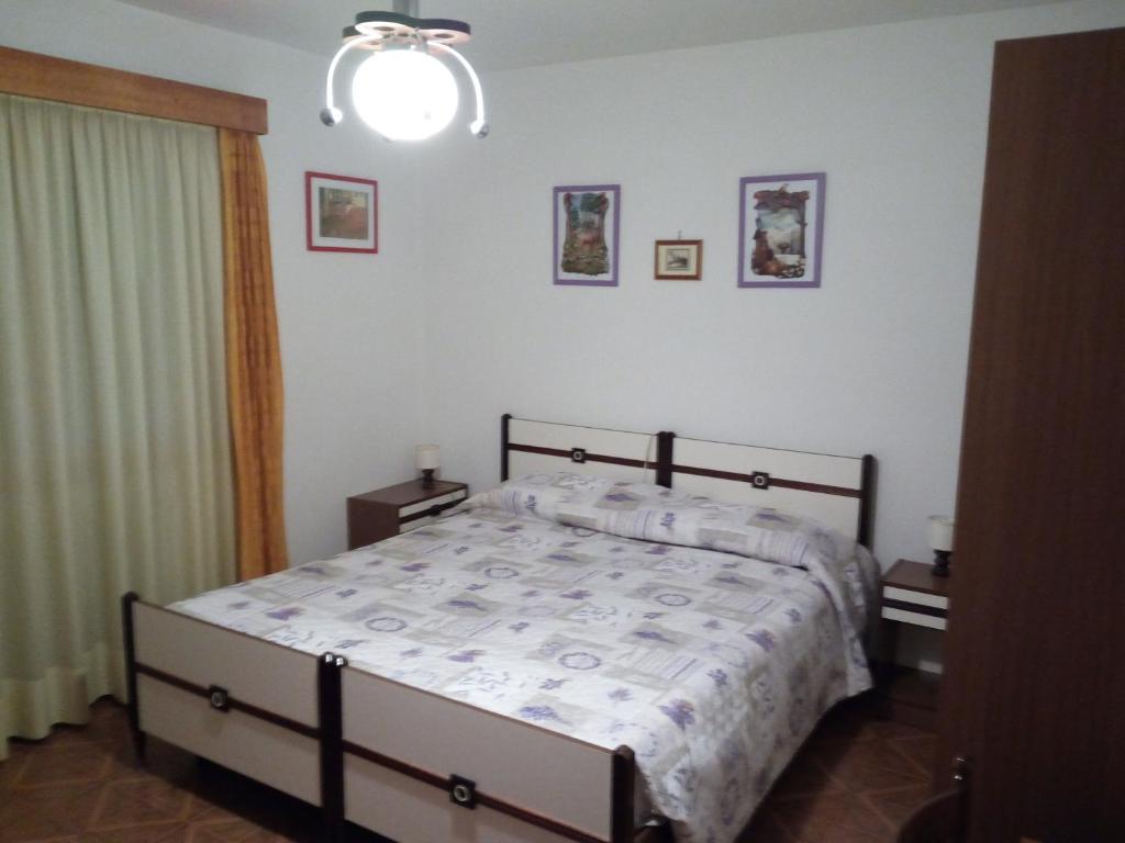 Postel nebo postele na pokoji v ubytování Albergo Al Pino