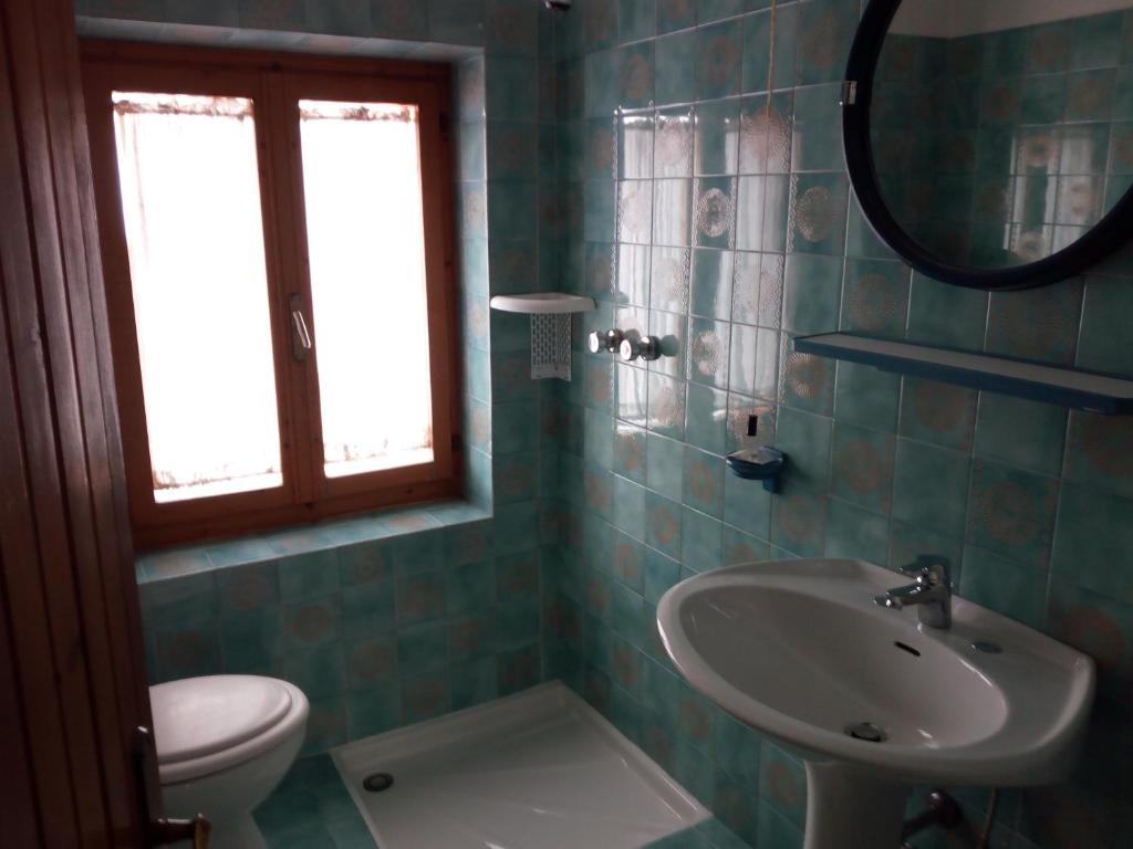 Koupelna v ubytování Albergo Al Pino