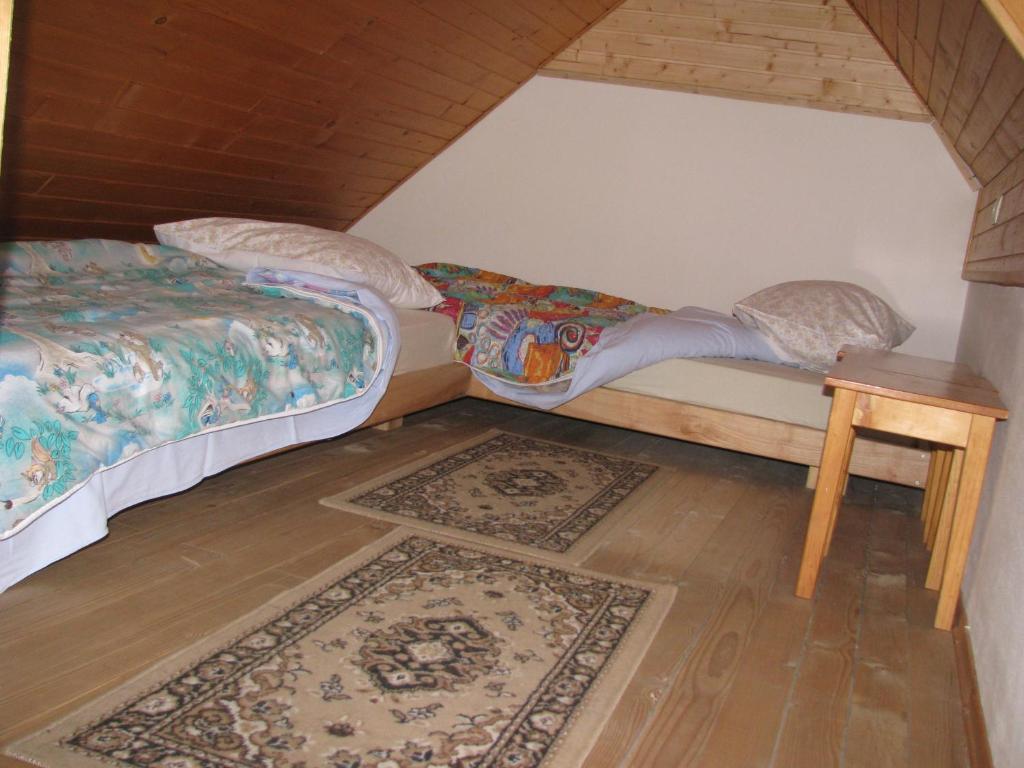 Postel nebo postele na pokoji v ubytování APARTMAJI STARI KOVAČ