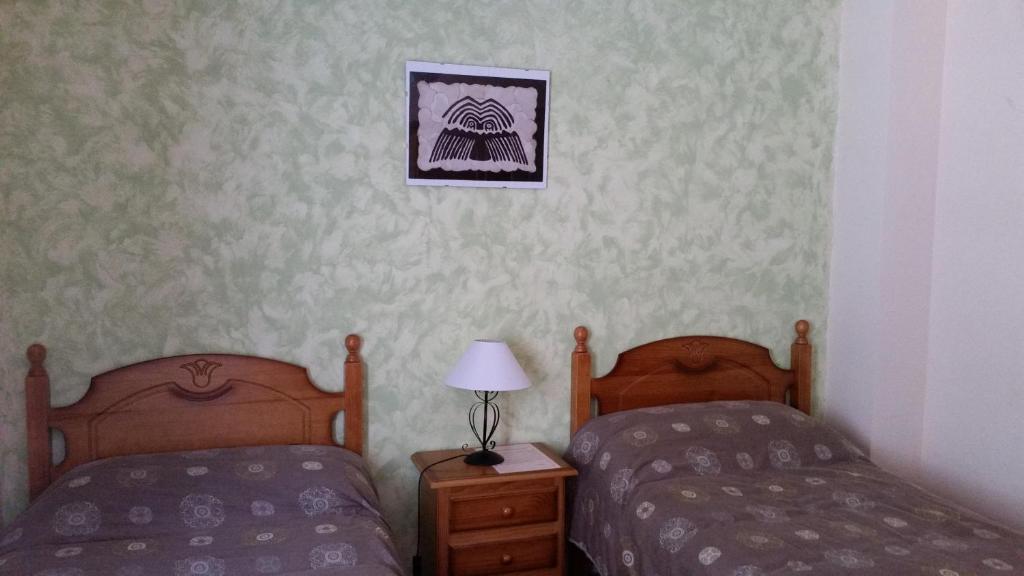 Postel nebo postele na pokoji v ubytování Albergue de Portilla