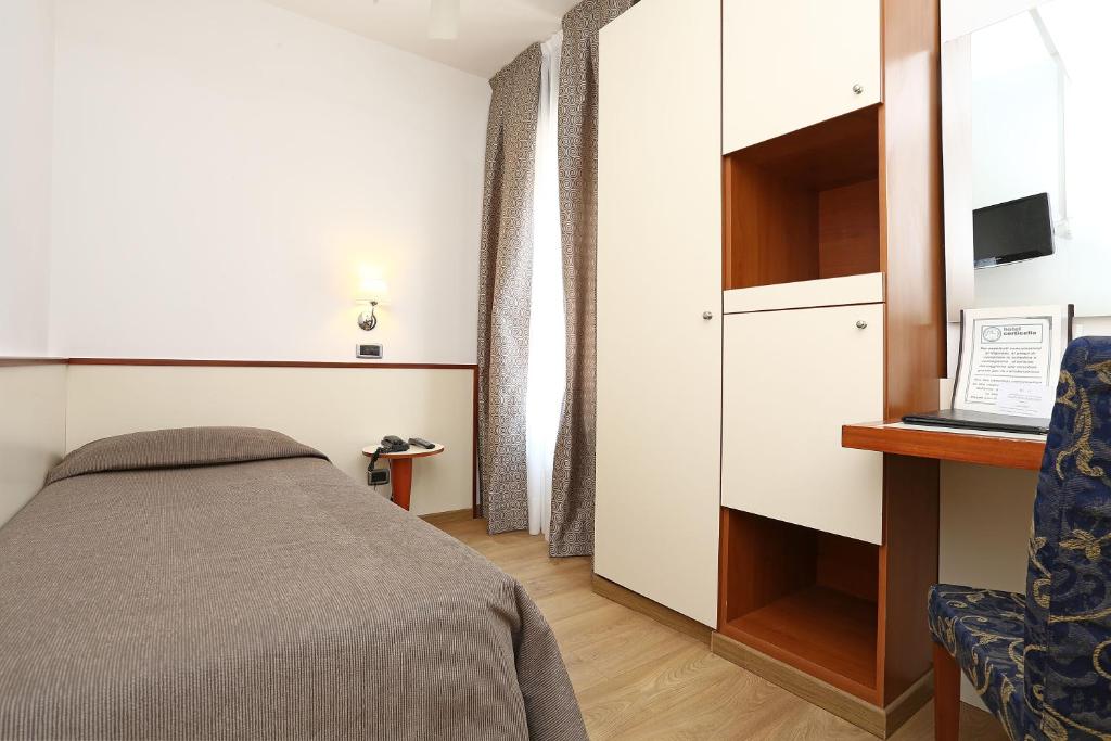 Postel nebo postele na pokoji v ubytování Hotel Corticella