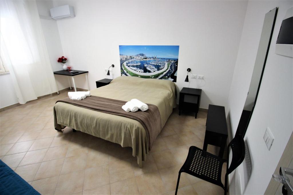 Postel nebo postele na pokoji v ubytování B&B Into Palermo Rooms