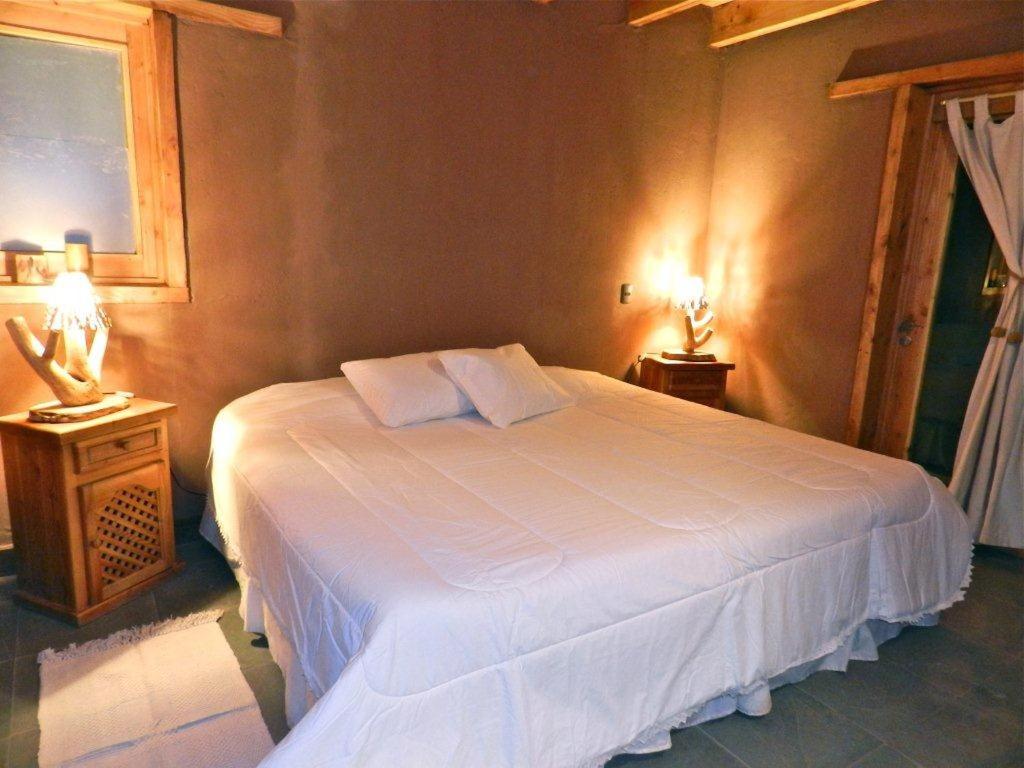 Postel nebo postele na pokoji v ubytování Terra Luna Atacama