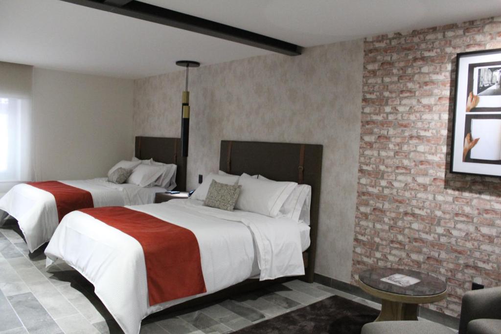 Postel nebo postele na pokoji v ubytování Hotel Ronda Minerva