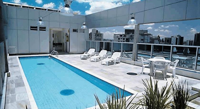 a swimming pool on the roof of a building at San Diego Apto 808 in Belo Horizonte