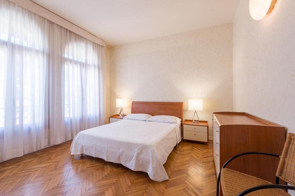 A bed or beds in a room at Appartamento Masha