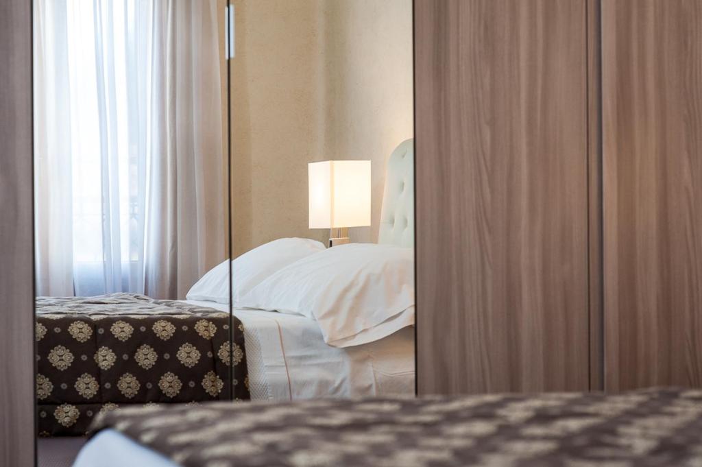 A bed or beds in a room at Appartamento Masha