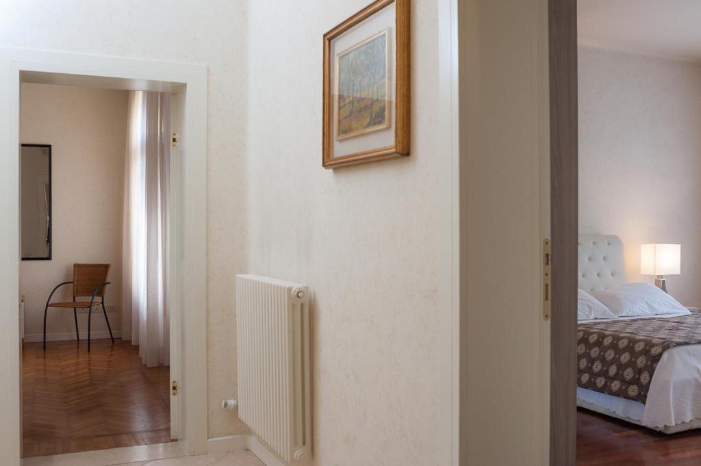 A bed or beds in a room at Appartamento Masha