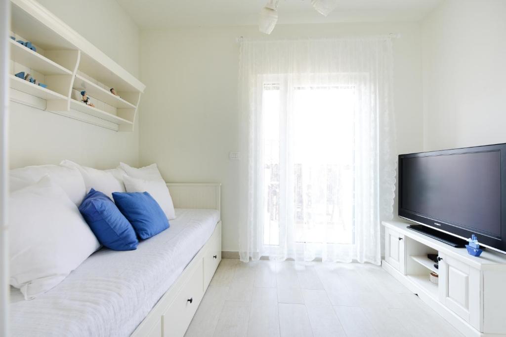 Postel nebo postele na pokoji v ubytování Apartments ZARA & TONI