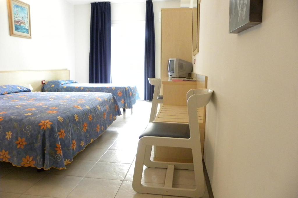 Postel nebo postele na pokoji v ubytování Hotel Santa Cruz