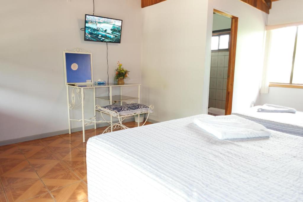 Postel nebo postele na pokoji v ubytování Hotel La Arena