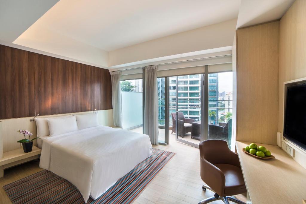 Giường trong phòng chung tại Oasia Hotel Novena, Singapore by Far East Hospitality