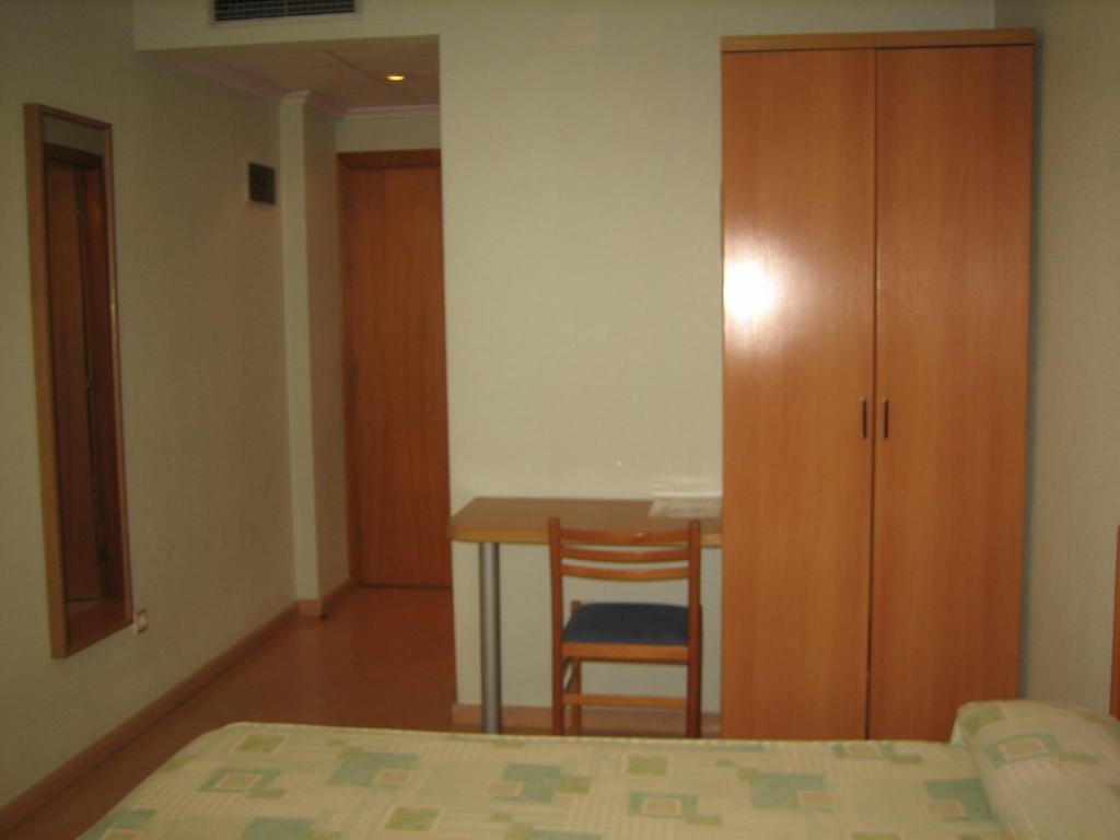 Posteľ alebo postele v izbe v ubytovaní Hostal Madruga