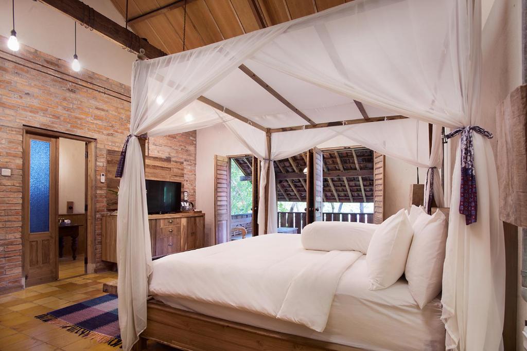 Postel nebo postele na pokoji v ubytování Desa Alamanis Resort Villa
