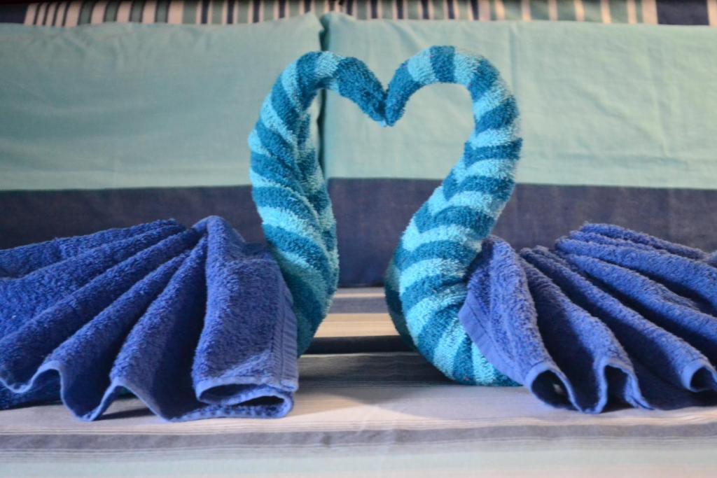a group of towels sitting next to a heart at Villa Viva Belgica in Davao City