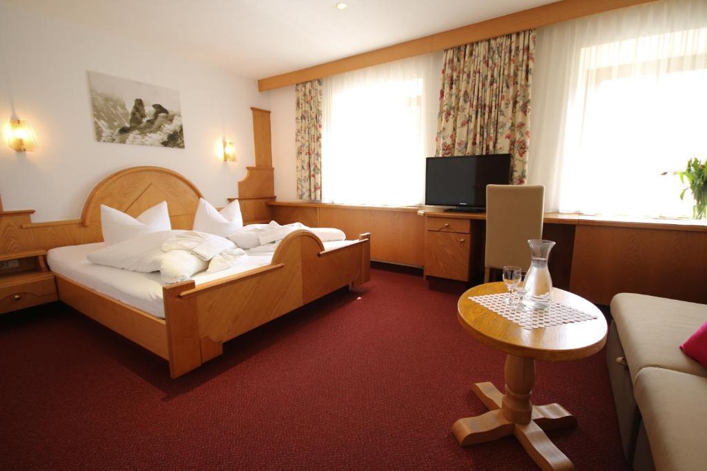 Posteľ alebo postele v izbe v ubytovaní Hotel Gasthof Neuner