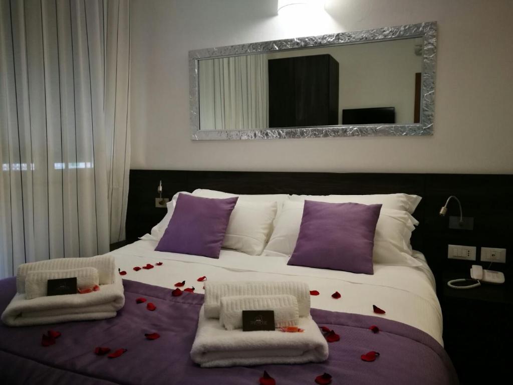 Postel nebo postele na pokoji v ubytování Hotel Tre Rose