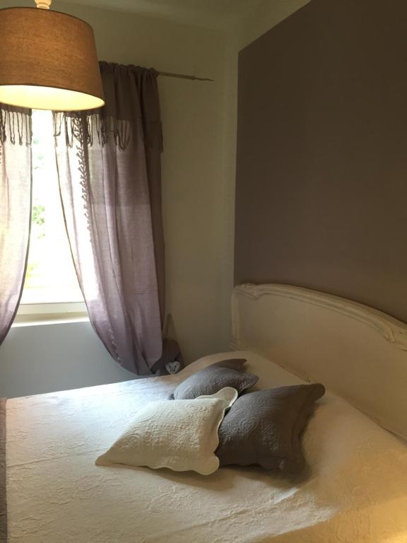 Postel nebo postele na pokoji v ubytování Ala Garden Apartment