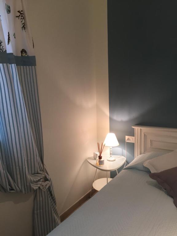 Postel nebo postele na pokoji v ubytování Ala Garden Apartment