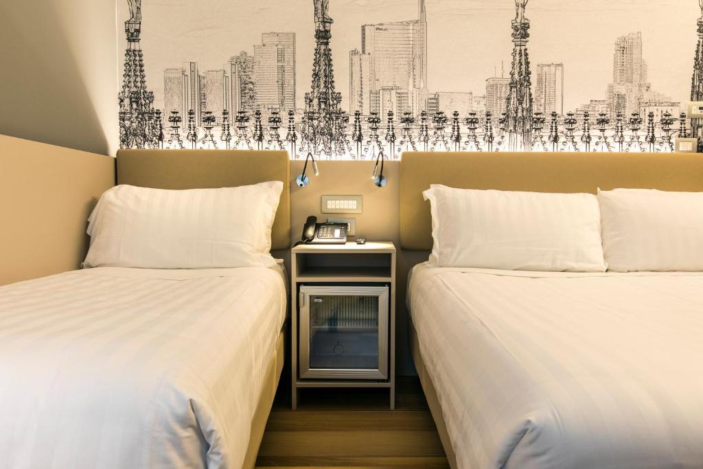 Postel nebo postele na pokoji v ubytování 43 Station Hotel