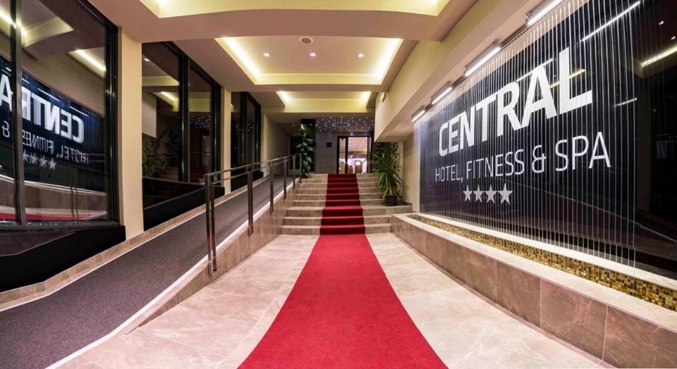 a red carpet in the hallway of a building at Central Hotel, Fitness and Spa in Vinica