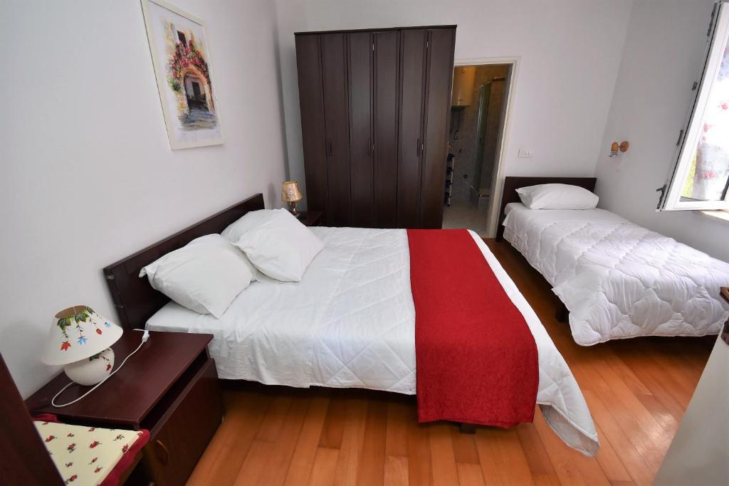 Postel nebo postele na pokoji v ubytování Nikic Apartments