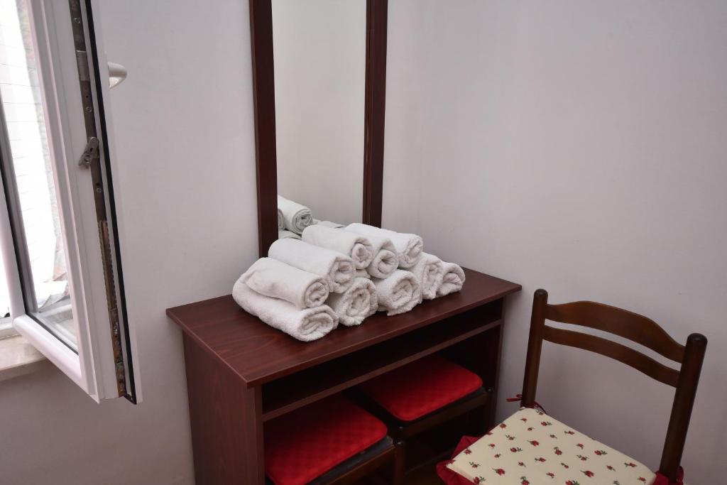 Postel nebo postele na pokoji v ubytování Nikic Apartments