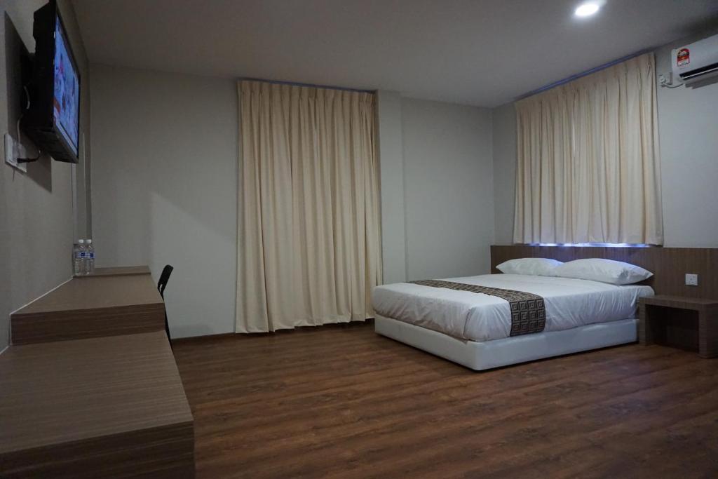 Postel nebo postele na pokoji v ubytování Yew Hotel