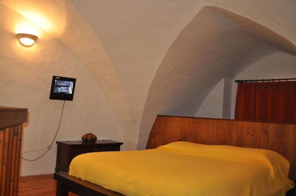 Postel nebo postele na pokoji v ubytování Le Casette di Via Roma