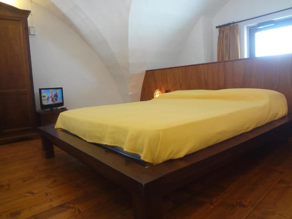Postel nebo postele na pokoji v ubytování Le Casette di Via Roma