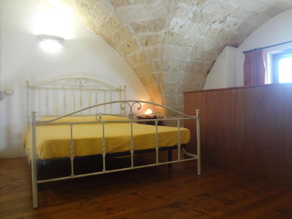 Postel nebo postele na pokoji v ubytování Le Casette di Via Roma