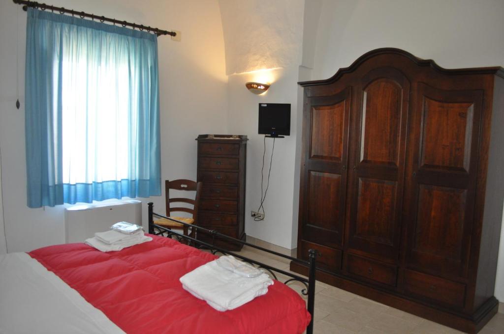 Postel nebo postele na pokoji v ubytování Le Casette di Via Roma