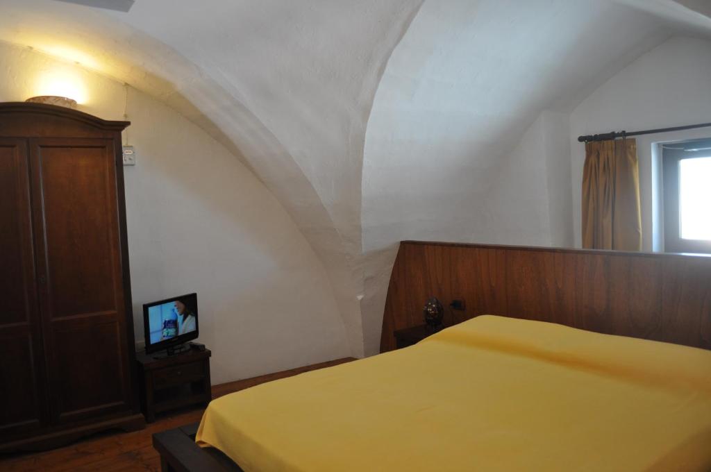 Postel nebo postele na pokoji v ubytování Le Casette di Via Roma