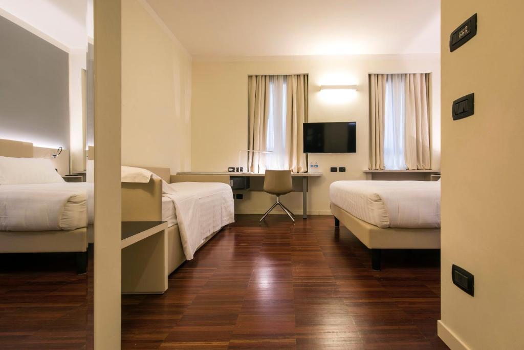 Postel nebo postele na pokoji v ubytování 43 Station Hotel