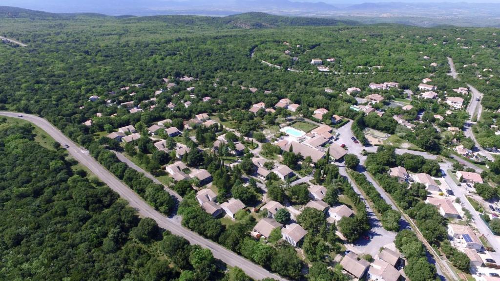 an aerial view of a residential neighborhood with a road at VVF Méjannes Gard in Méjannes-le-Clap