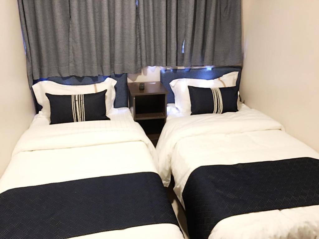 Postel nebo postele na pokoji v ubytování California Hotel