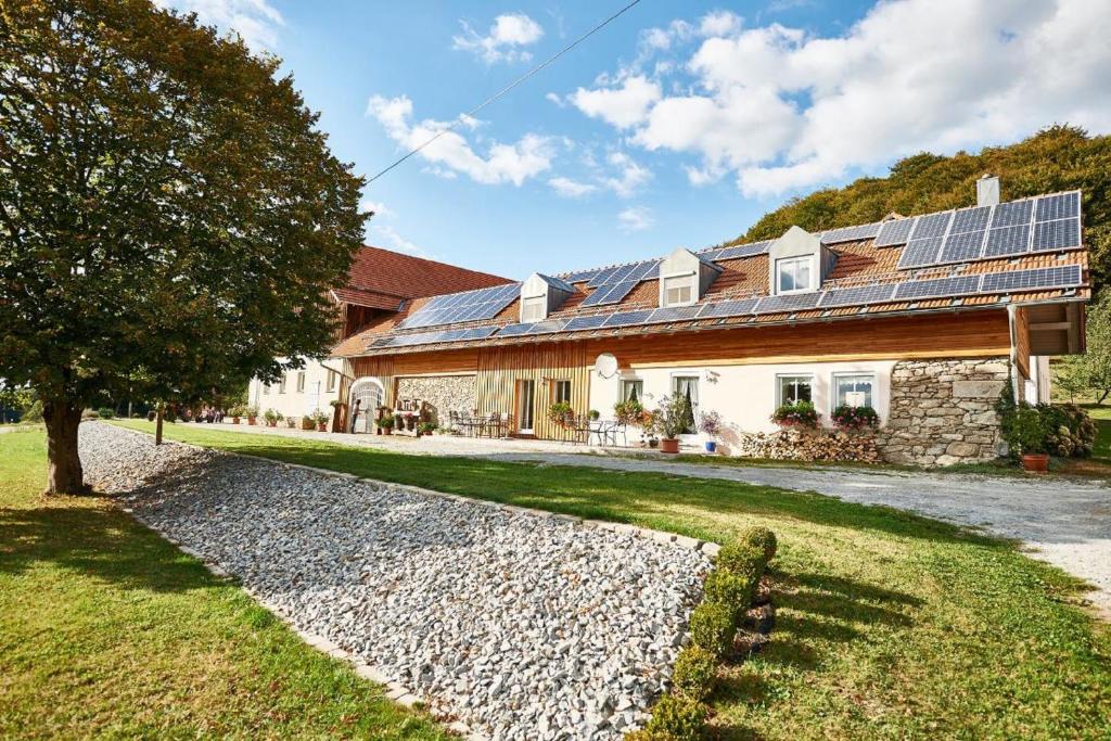 a house with solar panels on top of it at Ferienhof Stetter in Schöllnach