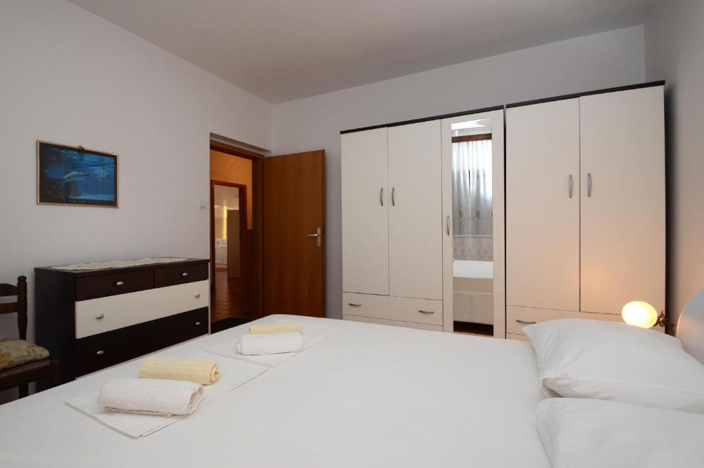 Кровать или кровати в номере Apartments Marijana