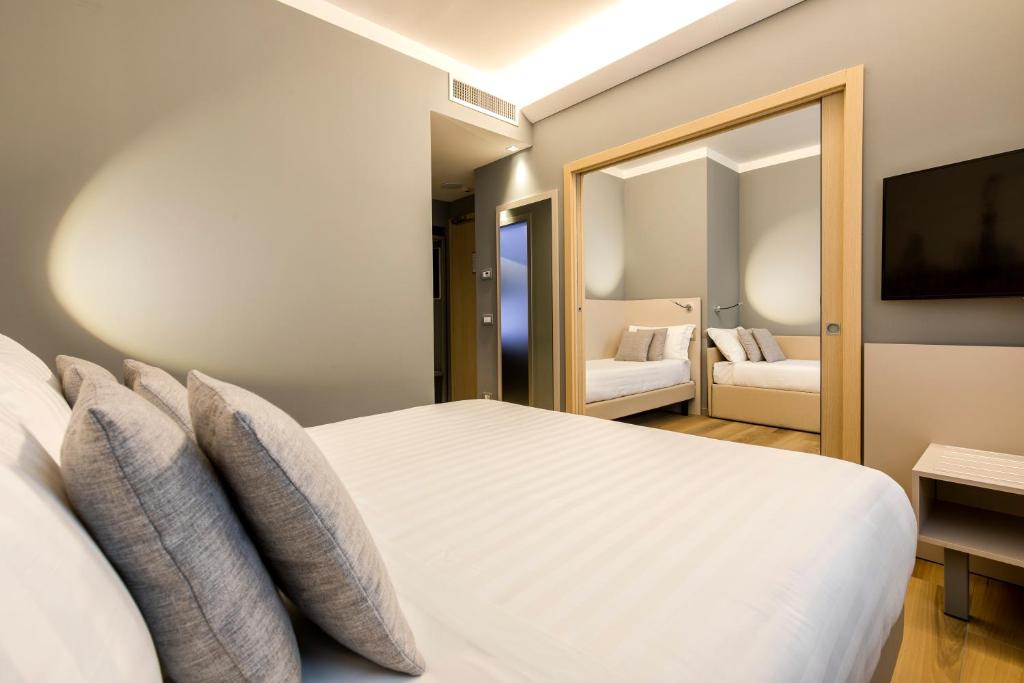 Postel nebo postele na pokoji v ubytování 43 Station Hotel