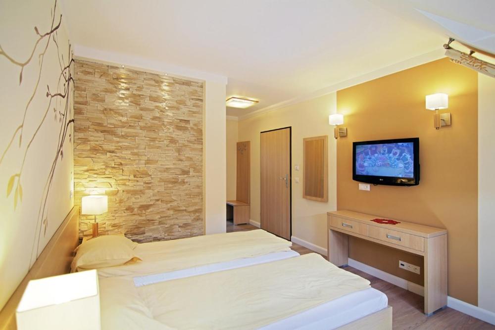 Postel nebo postele na pokoji v ubytování Dolina Leśnicy SKI & SPA Resort
