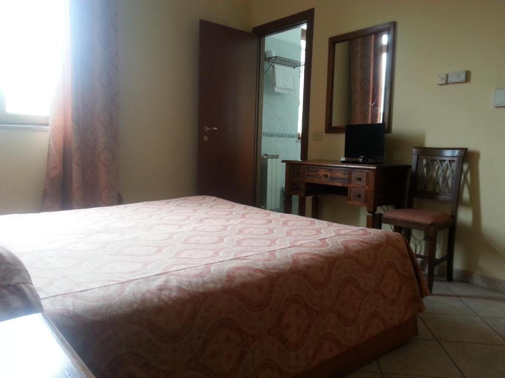 Postel nebo postele na pokoji v ubytování Hotel Tempio di Apollo