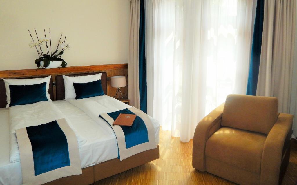 Postel nebo postele na pokoji v ubytování Brasserie Beierhaascht