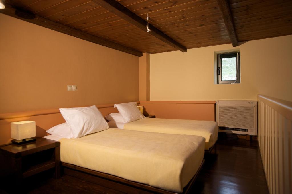 Posteľ alebo postele v izbe v ubytovaní Melitsina Village Hotel
