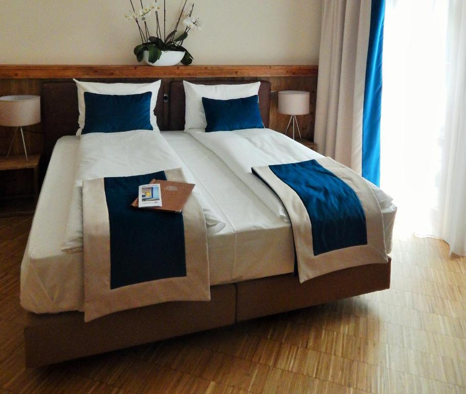 Postel nebo postele na pokoji v ubytování Brasserie Beierhaascht