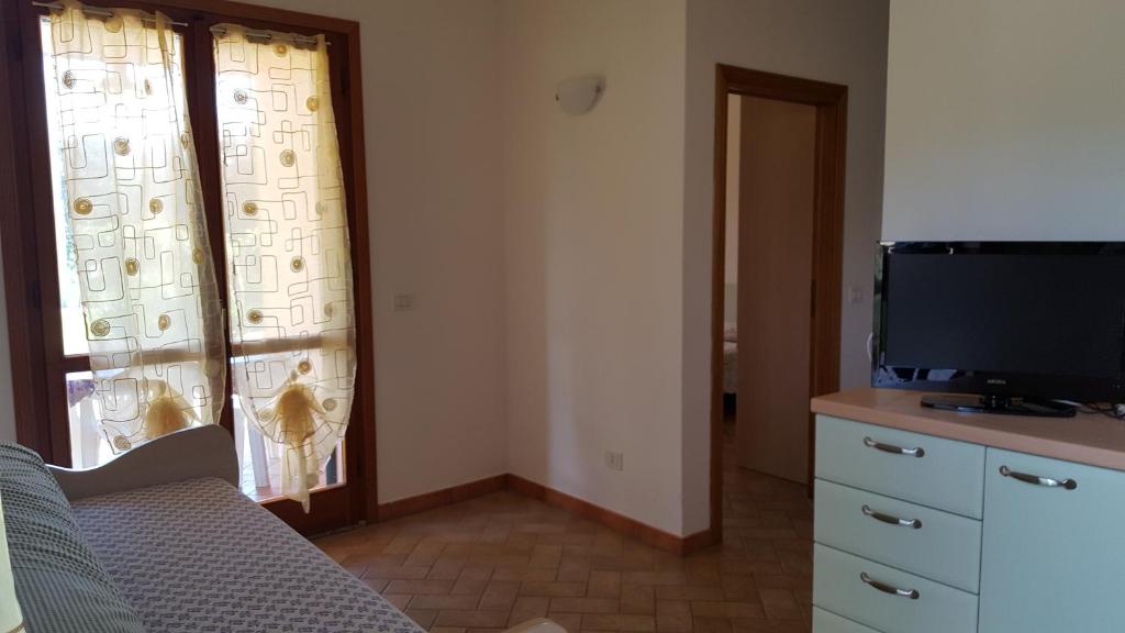 TV a/nebo společenská místnost v ubytování Agriturismo Rebua