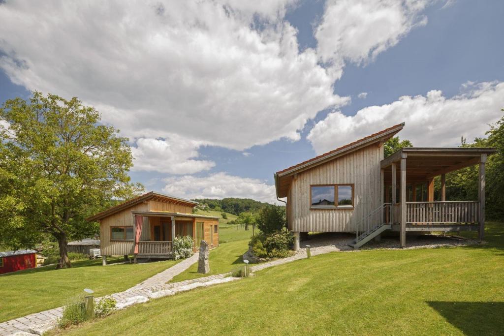 a home with a large yard with a house at Ferienhof Weltenburg in Kelheim