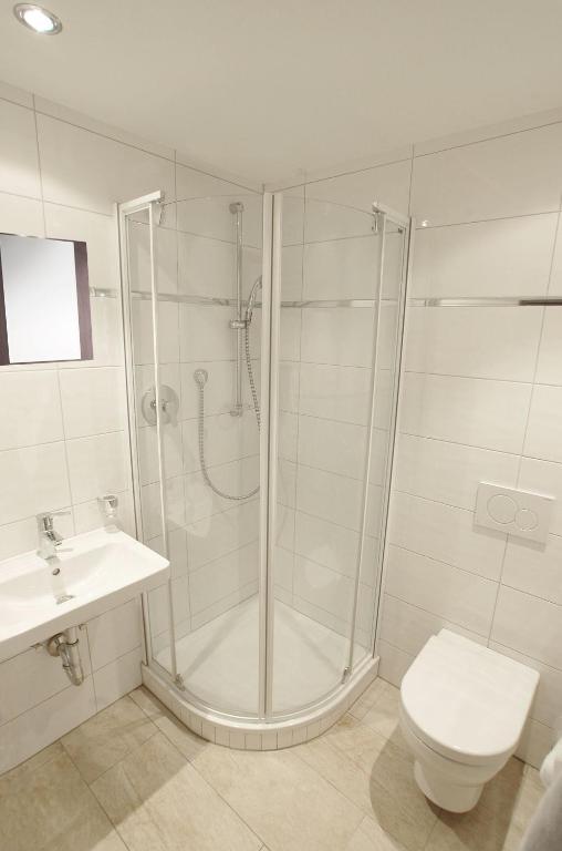 Koupelna v ubytování Hotel AlpinaRos